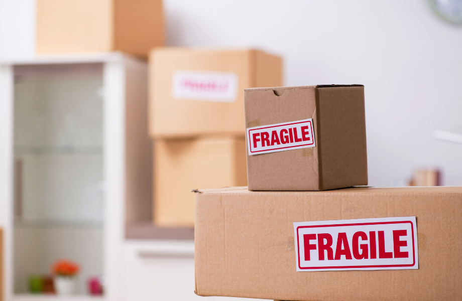 Pile of cupboard boxes labeled fragile 