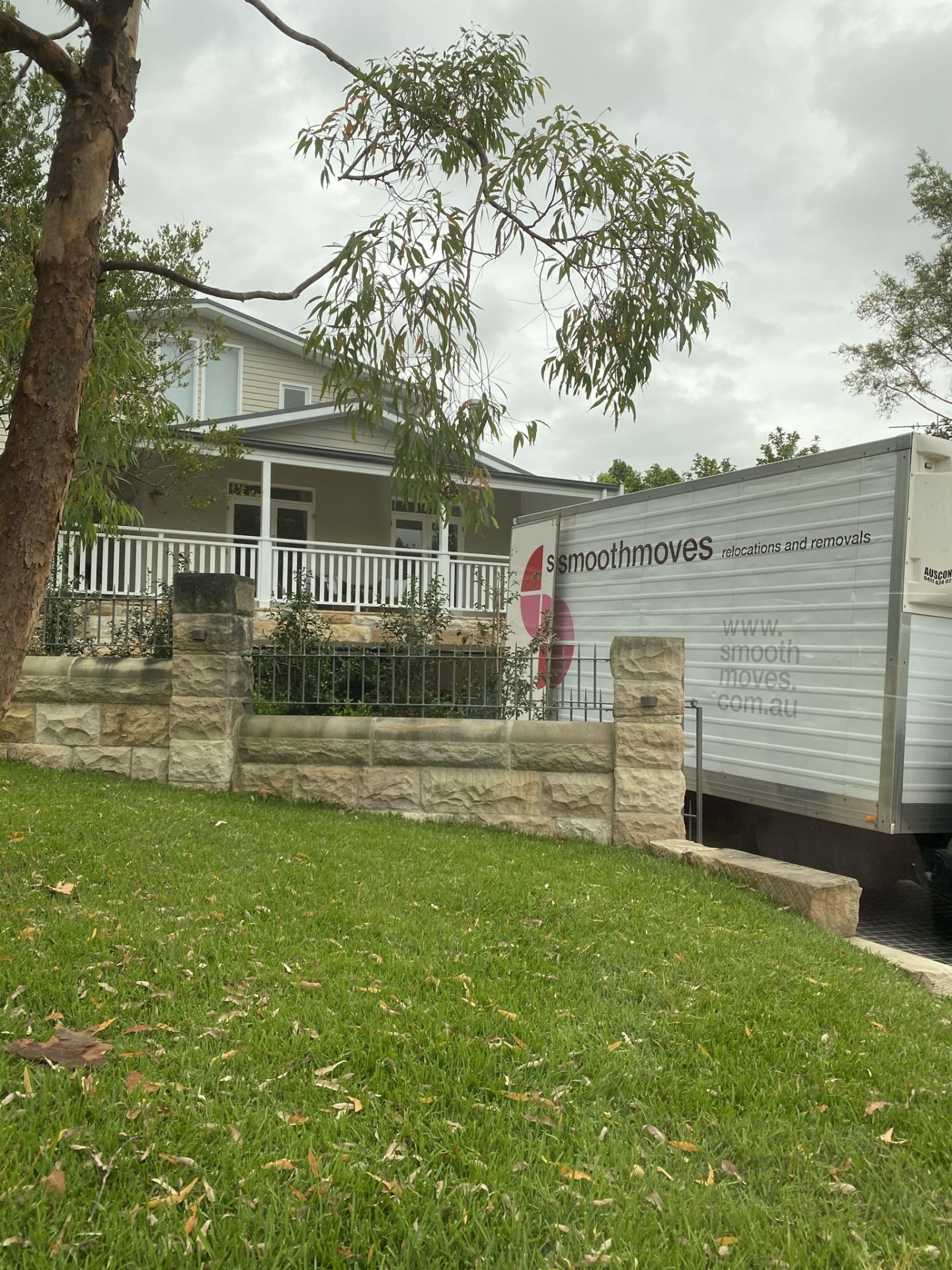 Smoothmoves truck parked outside of a property