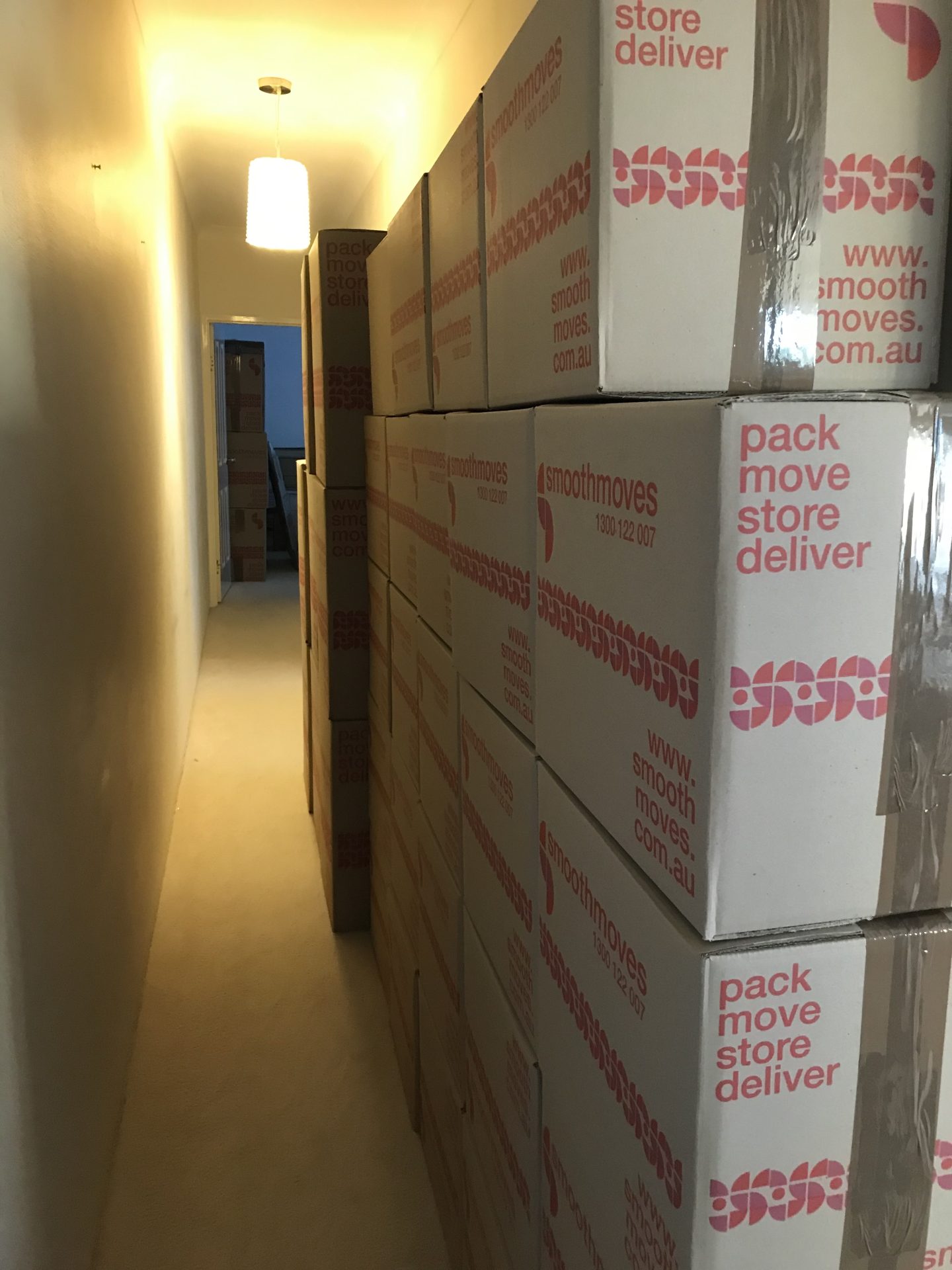 A stack of packed Smoothmoves boxes ready to be taken